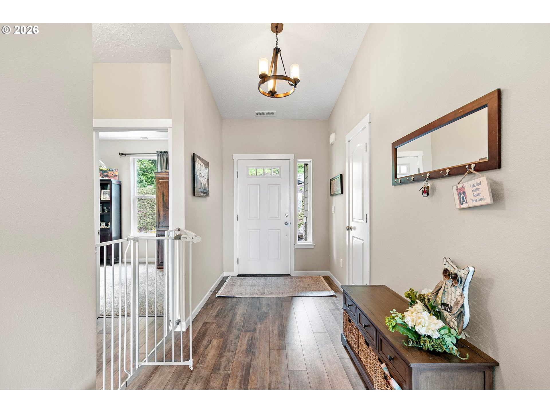 962 South 66th Place Springfield, OR 97478 - Photo 22 of 44 a hallway with furniture and wooden floor