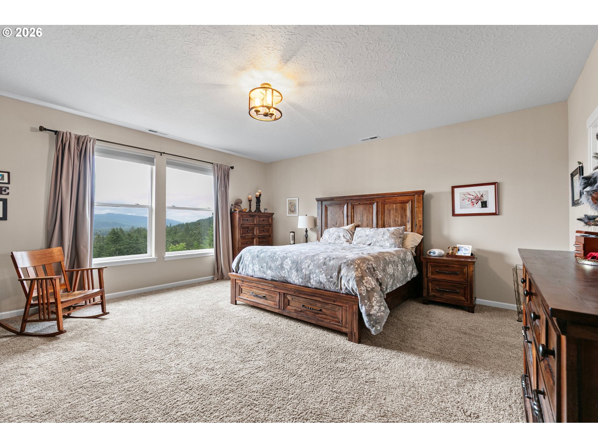 962 South 66th Place Springfield, OR 97478 - Photo 24 of 44 a spacious bedroom with a bed and a desk
