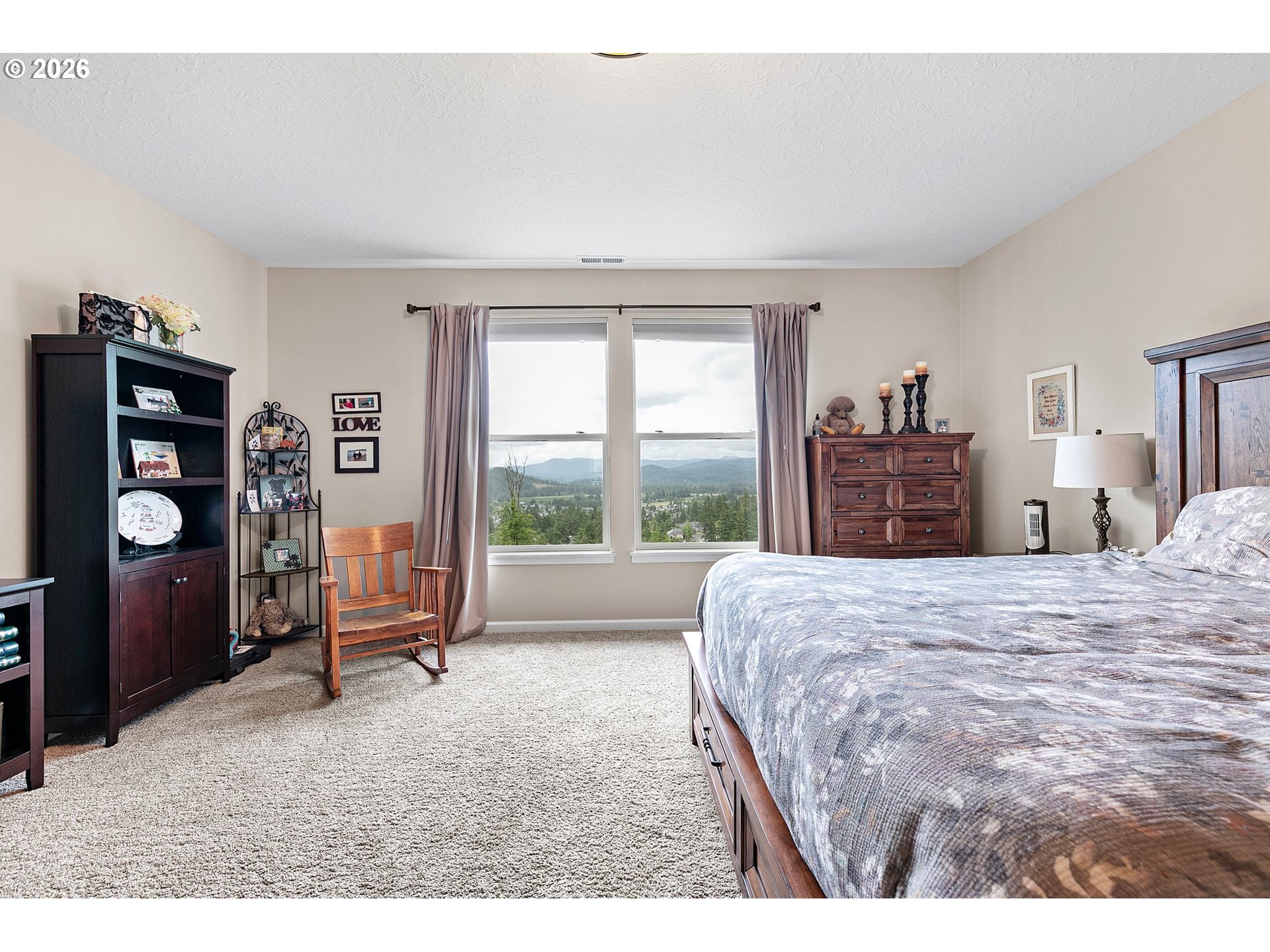 962 South 66th Place Springfield, OR 97478 - Photo 25 of 44 a bedroom with a bed and wooden floor