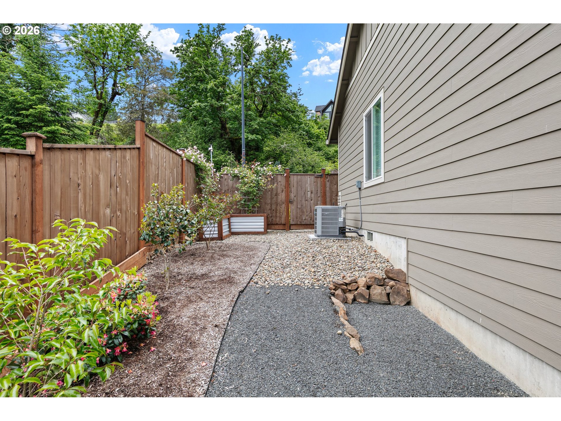962 South 66th Place Springfield, OR 97478 - Photo 33 of 44 a view of a backyard with plants and tree