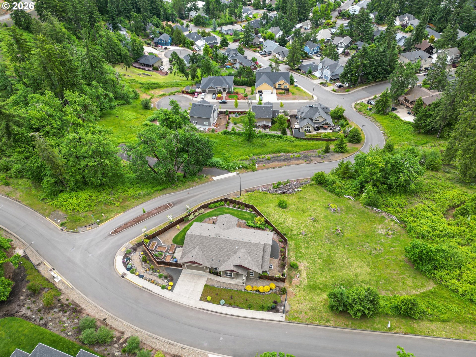 962 South 66th Place Springfield, OR 97478 - Photo 37 of 44 an aerial view of a house with a yard and lake view