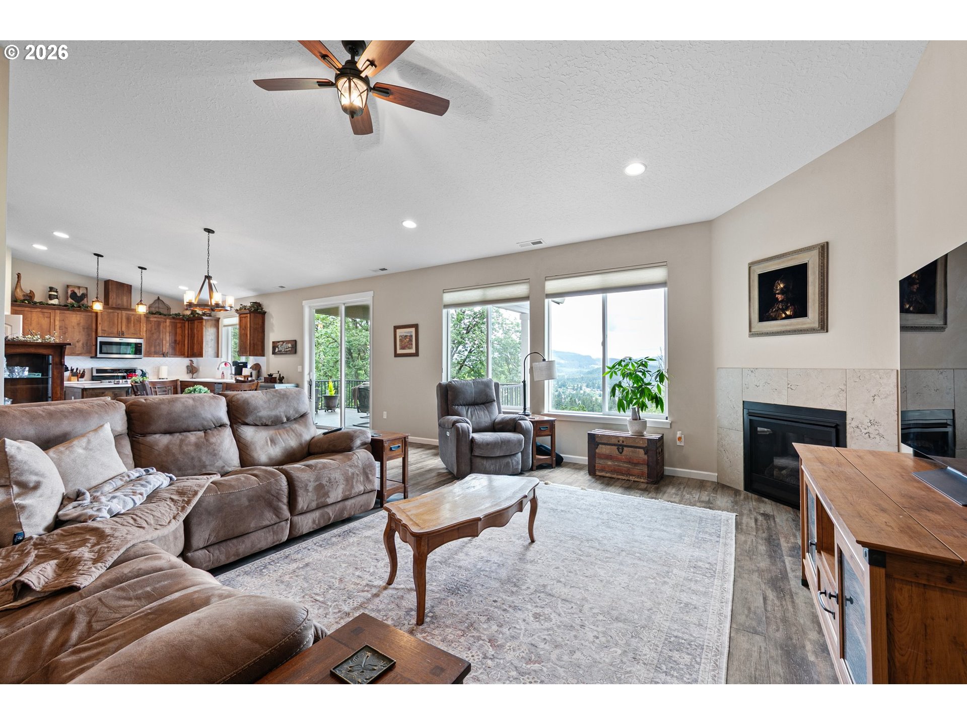 962 South 66th Place Springfield, OR 97478 - Photo 4 of 44 a living room with furniture fireplace and a large window