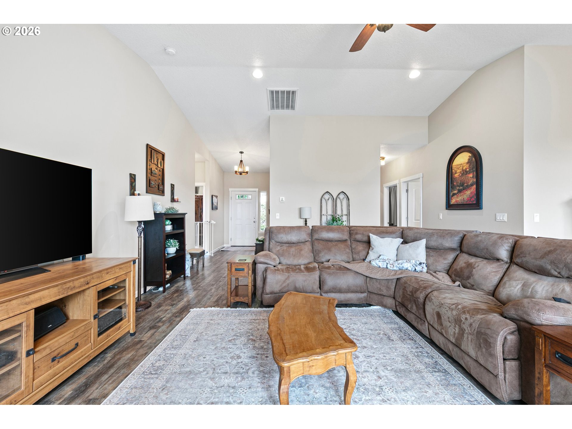 962 South 66th Place Springfield, OR 97478 - Photo 6 of 44 a living room with furniture and a flat screen tv