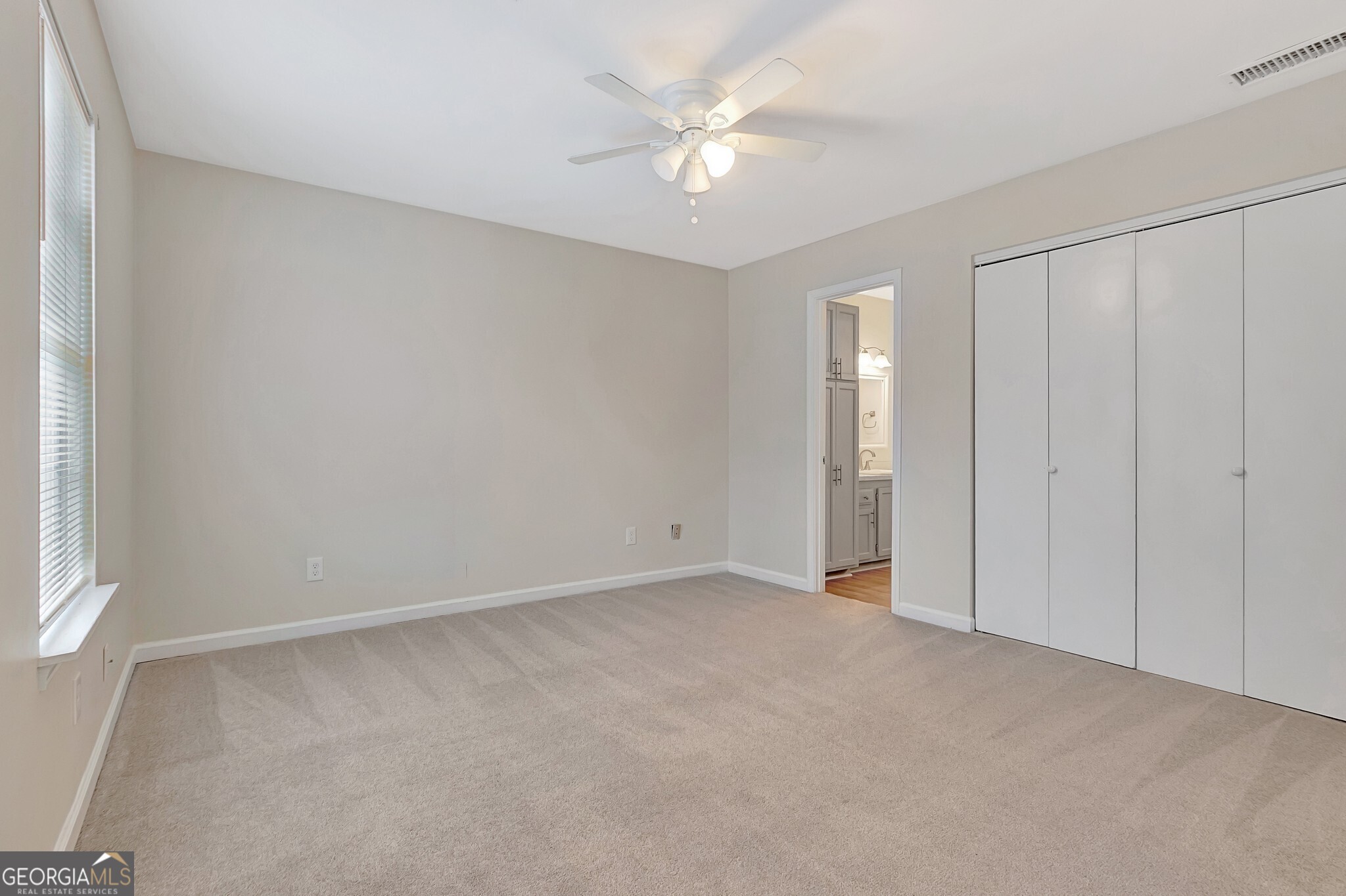 1946 Cornell Way Morrow, GA 30260 - Photo 25 of 31 an empty room with a ceiling fan and a window