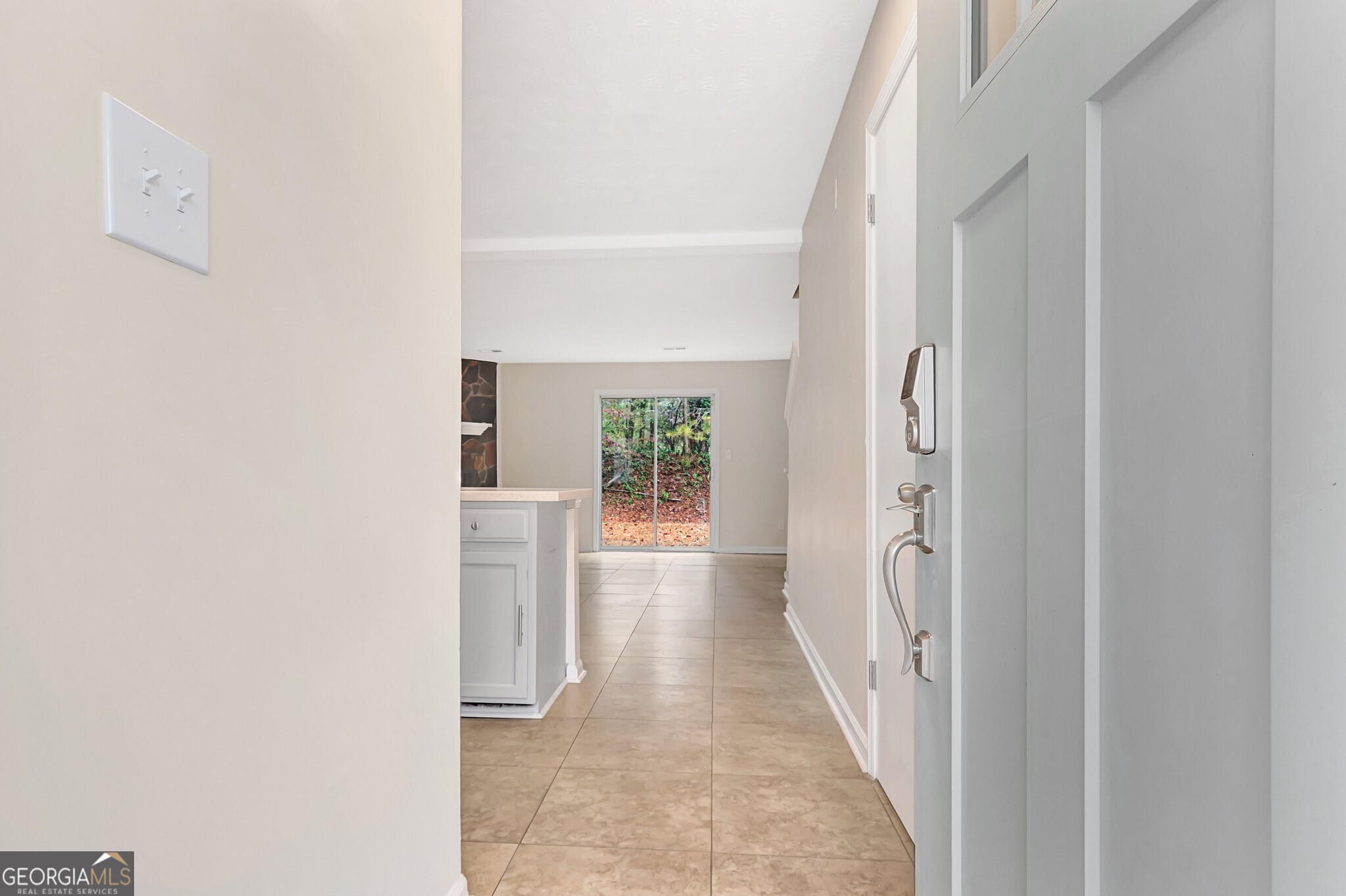 1946 Cornell Way Morrow, GA 30260 - Photo 4 of 31 a view of a hallway with white walls and wooden floor