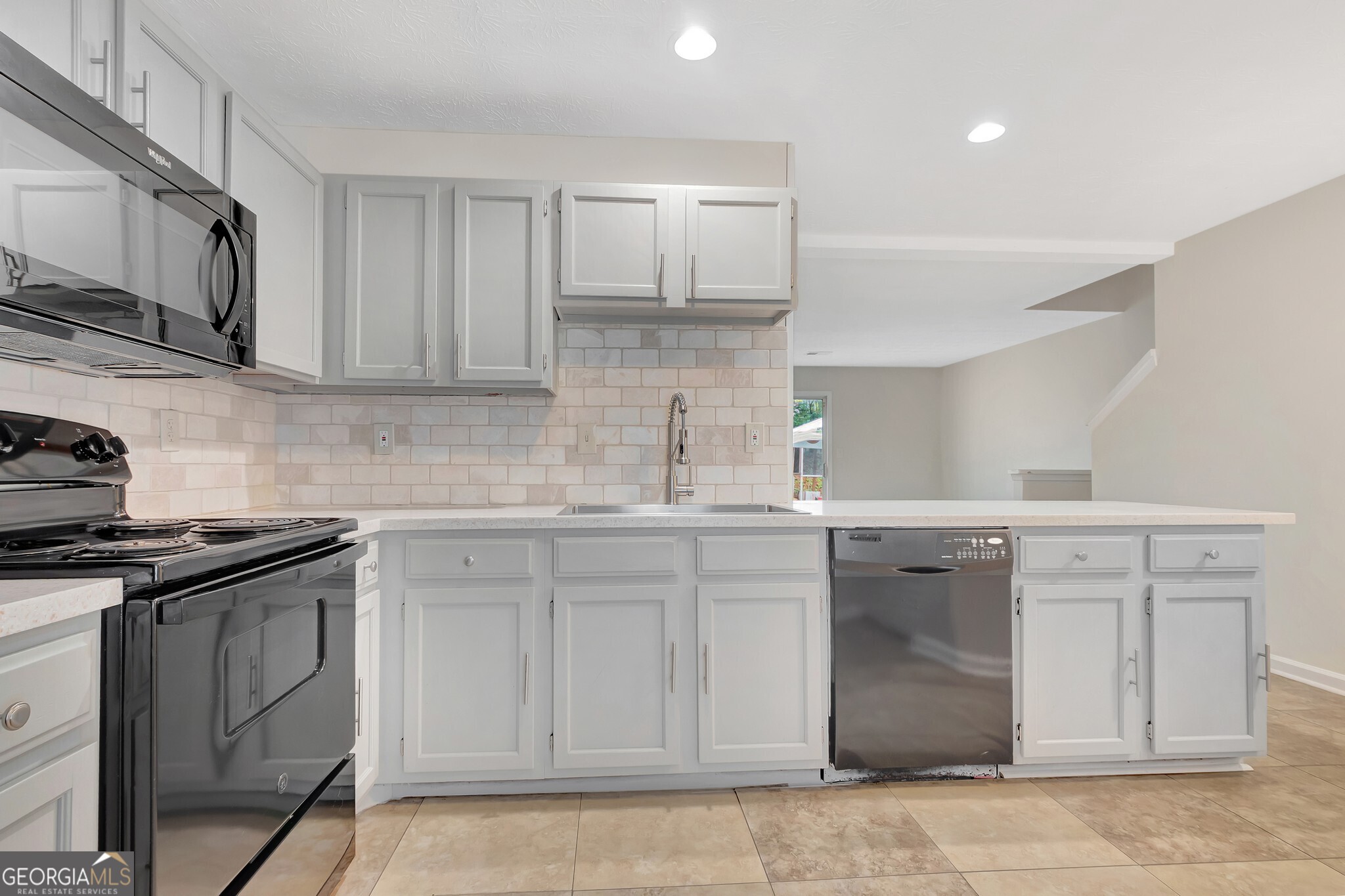 1946 Cornell Way Morrow, GA 30260 - Photo 9 of 31 a kitchen with white cabinets