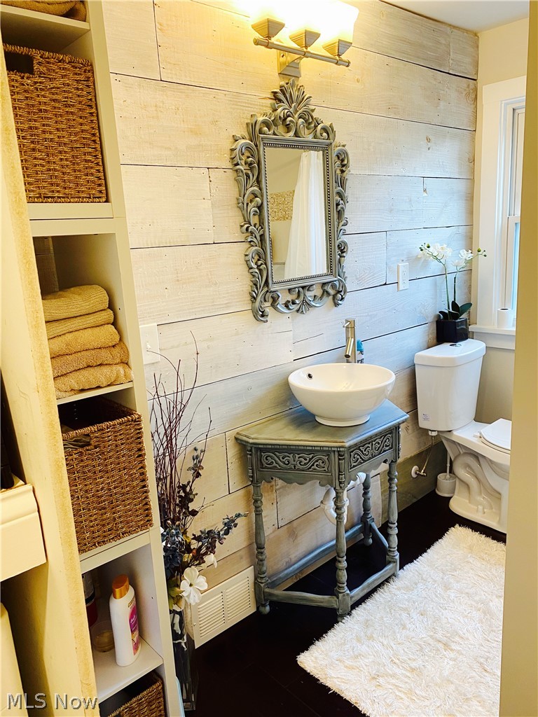 3626 Warren Road Cleveland, OH 44111 - Photo 24 of 34 Guest bath with reclaimed wood feature wall and 2nd floor laundry space