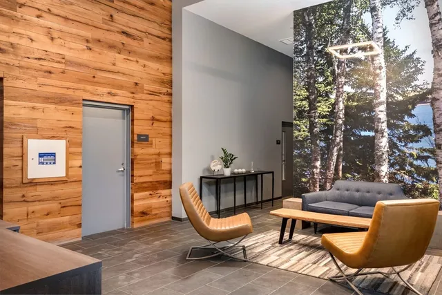 a balcony with table and chairs