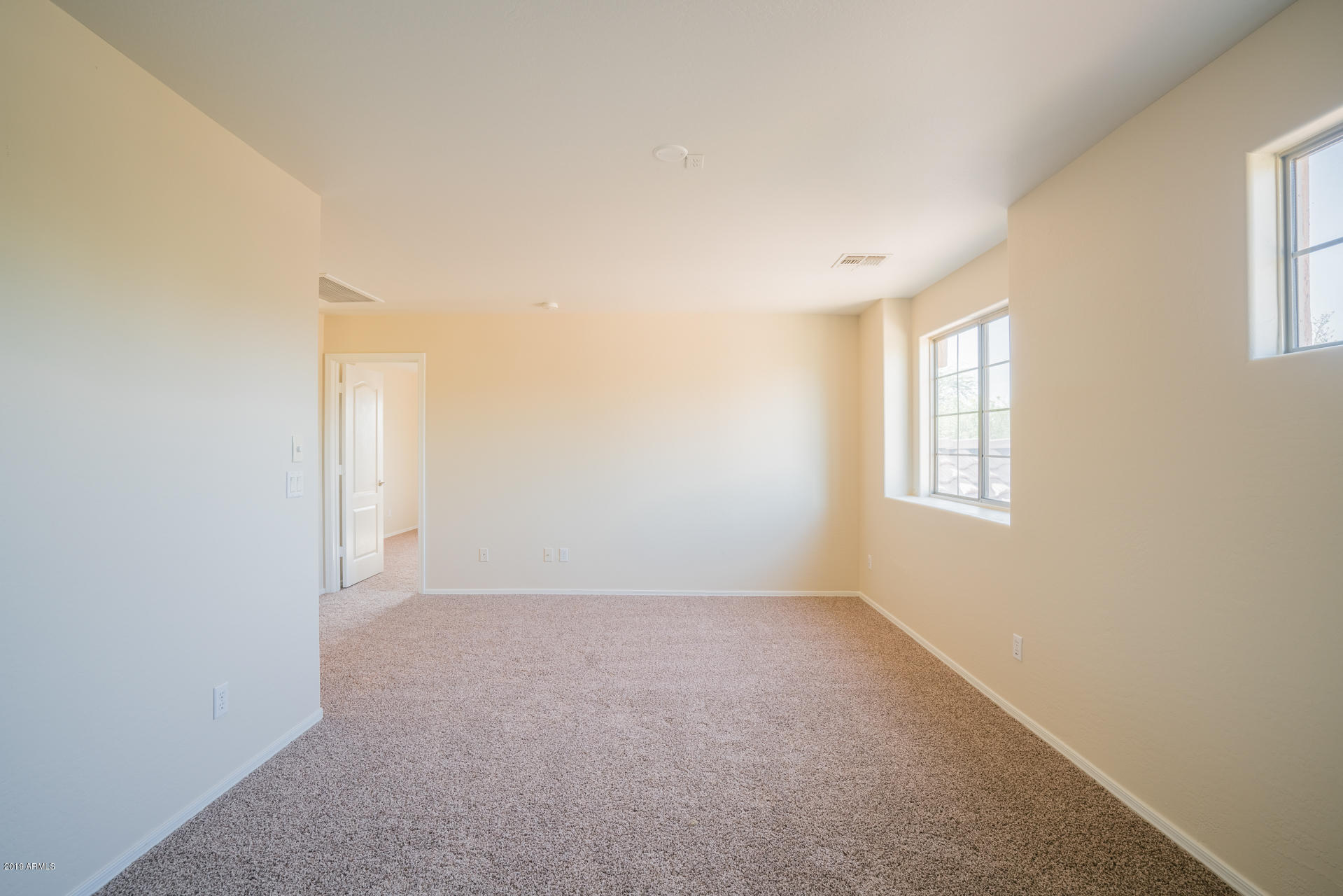 15441 West Shangri La Road Surprise, AZ 85379 - Photo 13 of 24 an empty room with windows