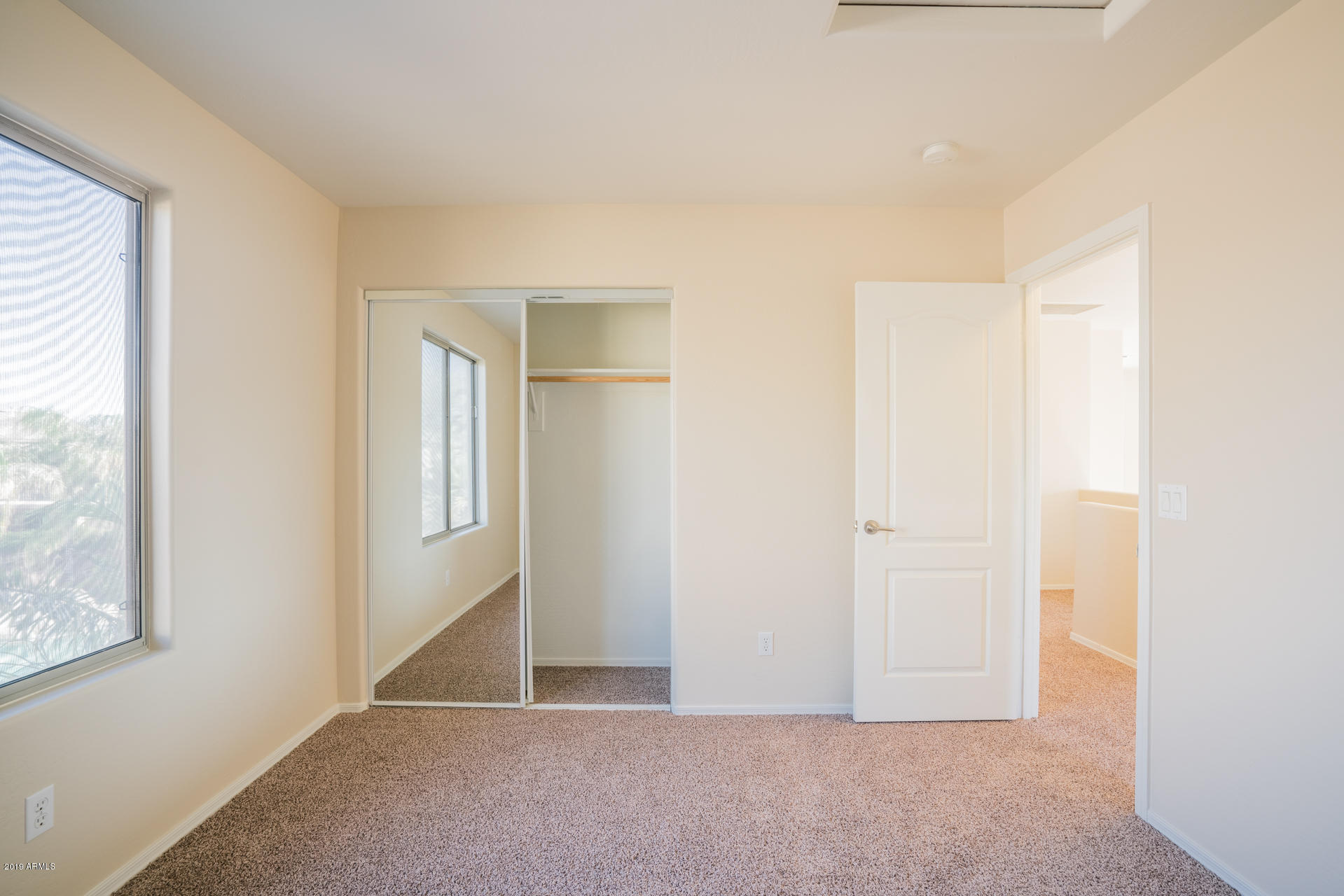 15441 West Shangri La Road Surprise, AZ 85379 - Photo 20 of 24 an empty room with windows