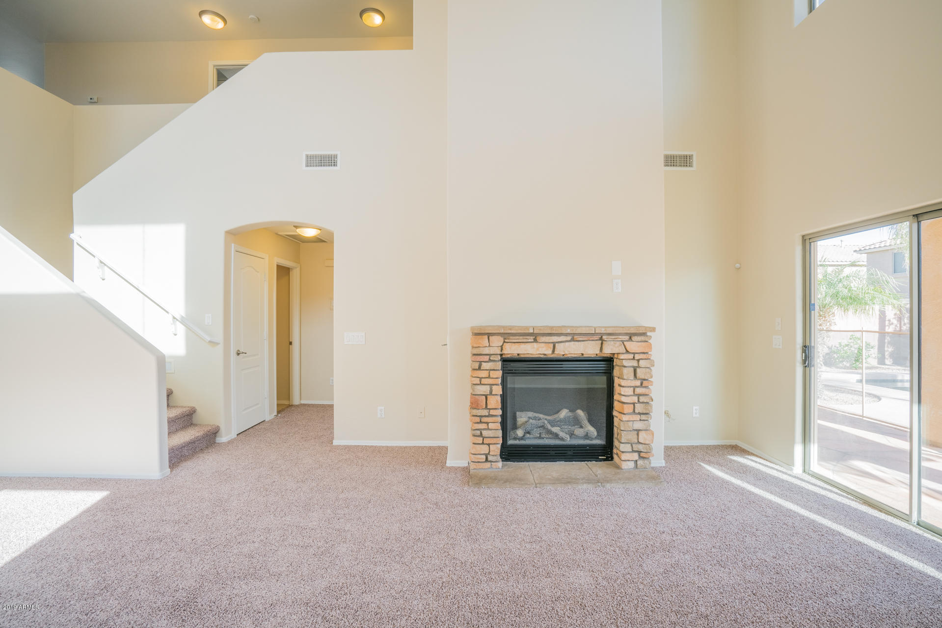 15441 West Shangri La Road Surprise, AZ 85379 - Photo 3 of 24 a view of empty room with a fireplace