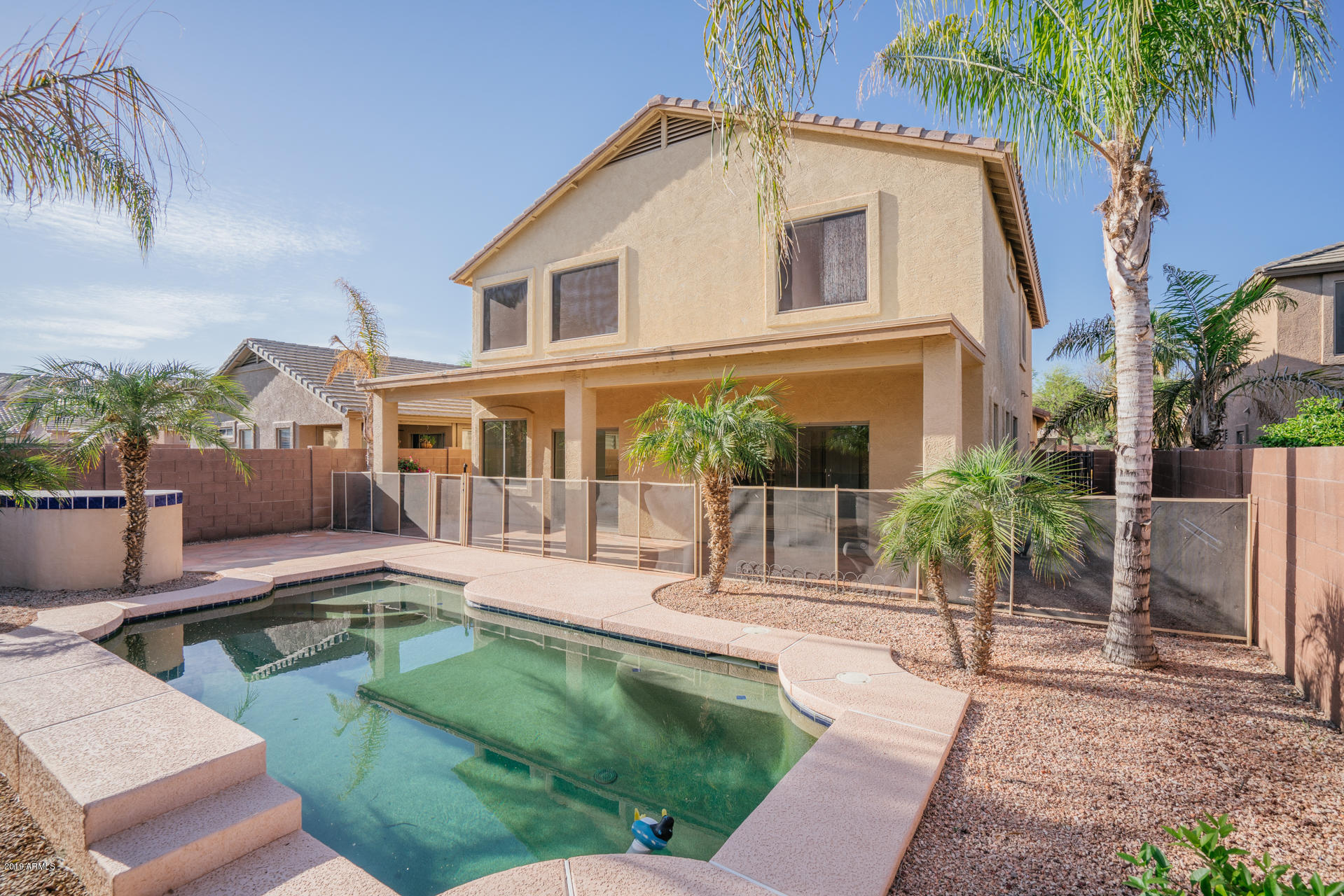 15441 West Shangri La Road Surprise, AZ 85379 - Photo 5 of 24 a house view with a seating space and garden