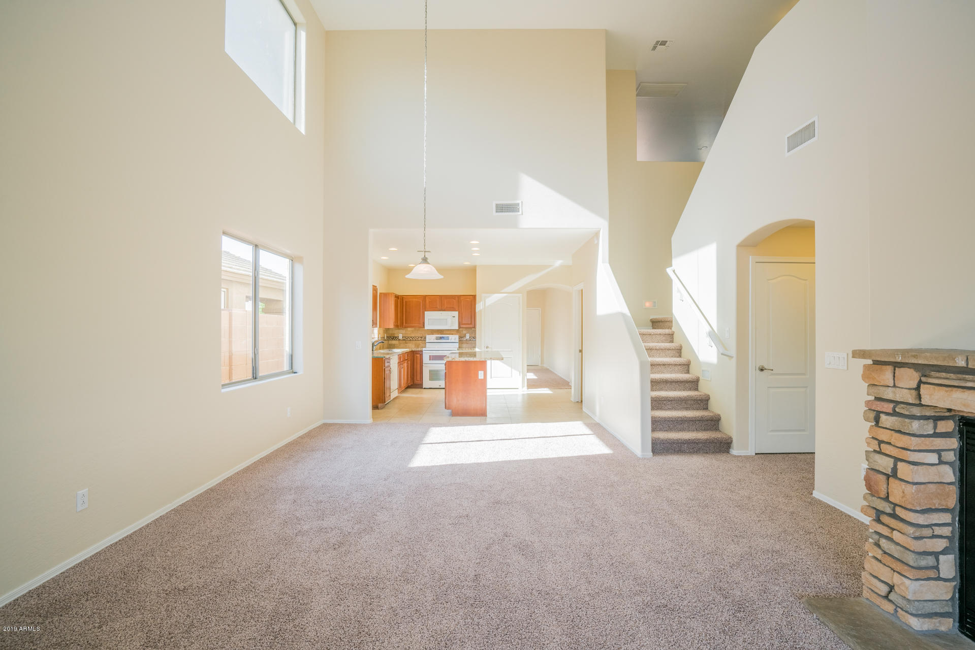 15441 West Shangri La Road Surprise, AZ 85379 - Photo 9 of 24 a view of a hallway with staircase