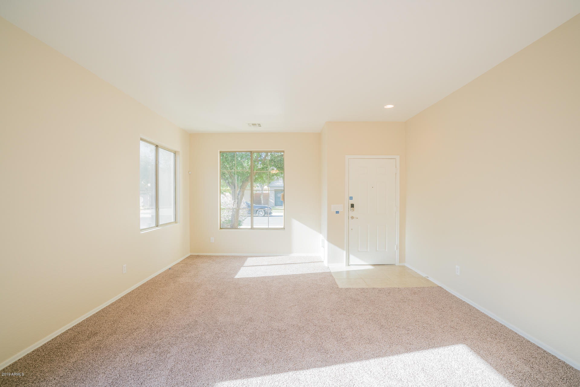 15441 West Shangri La Road Surprise, AZ 85379 - Photo 10 of 24 an empty room with windows