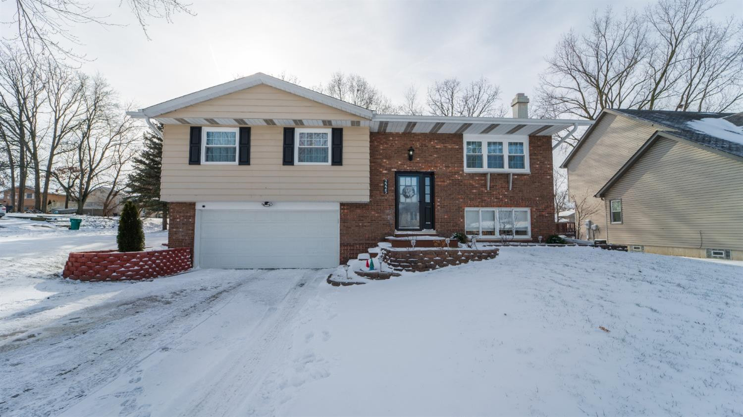 2225 Coldspring Road Crown Point, IN 46307 - Photo 1 of 22 a front view of a house with garage