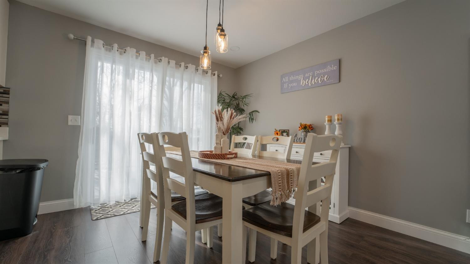 2225 Coldspring Road Crown Point, IN 46307 - Photo 9 of 22 a view of a dining room with furniture and wooden floor