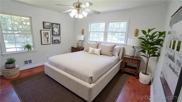 a bedroom with bed and a window