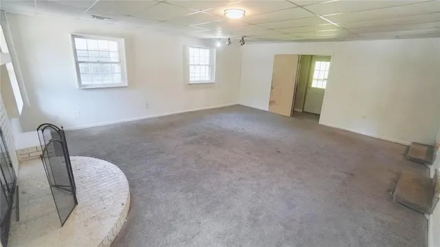 a view of a room with window and bathroom