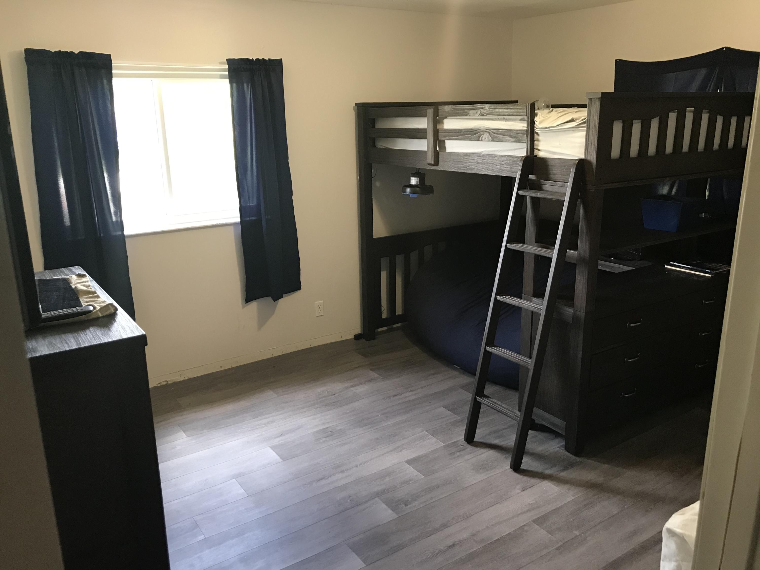 680 Southwest 17th Court Boca Raton, FL 33486 - Photo 14 of 27 a room with black door and furniture