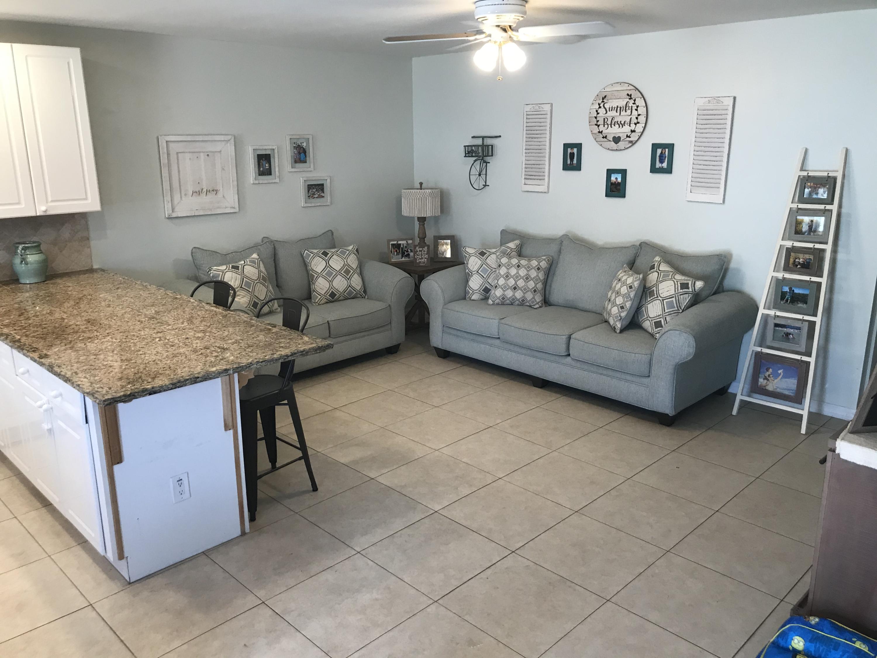 680 Southwest 17th Court Boca Raton, FL 33486 - Photo 17 of 27 a living room with furniture and a couch