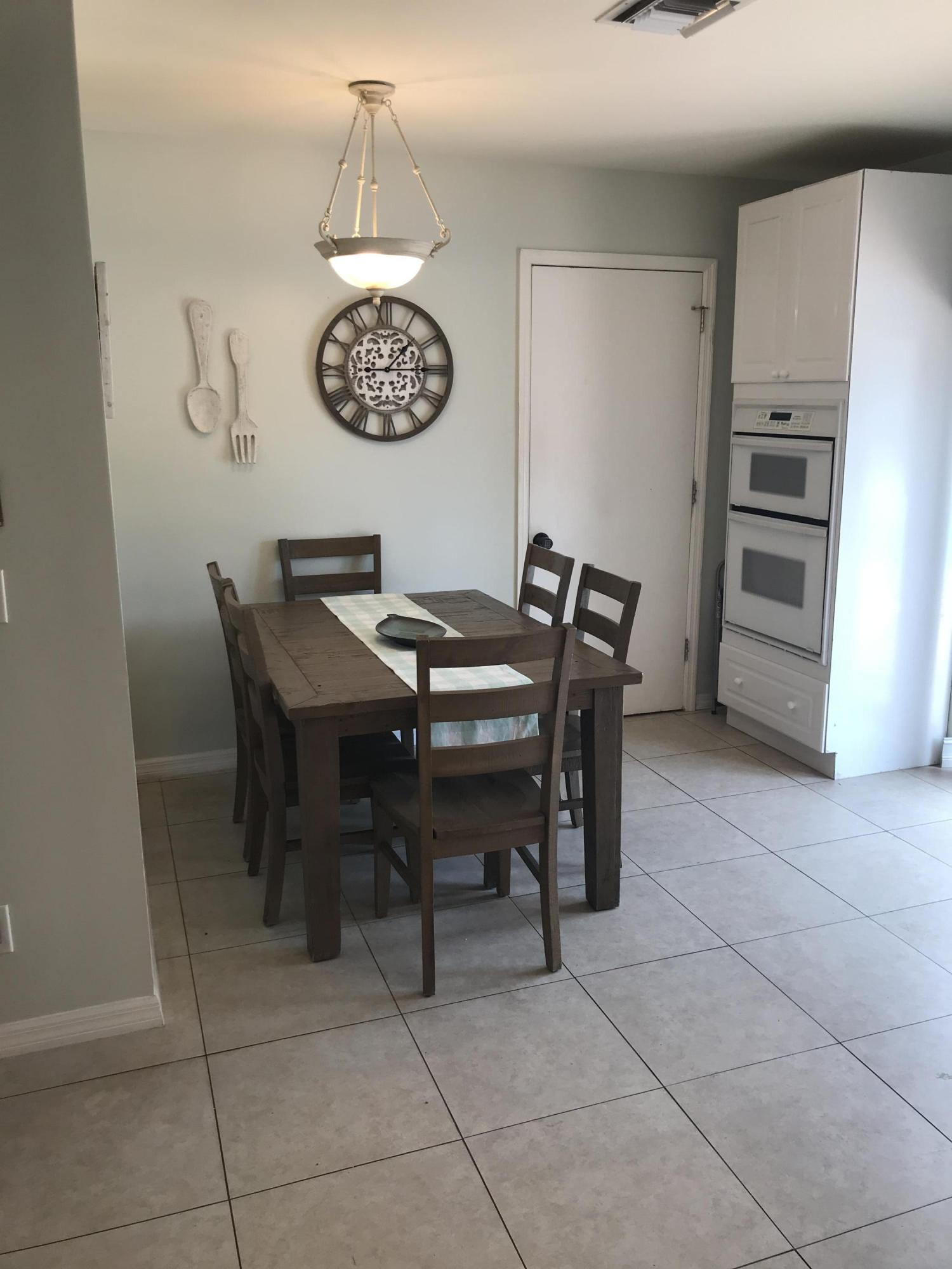 680 Southwest 17th Court Boca Raton, FL 33486 - Photo 21 of 27 a view of a dining room with furniture