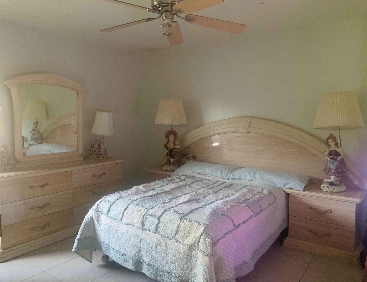 680 Southwest 17th Court Boca Raton, FL 33486 - Photo 25 of 27 a bedroom with a bed and a dresser
