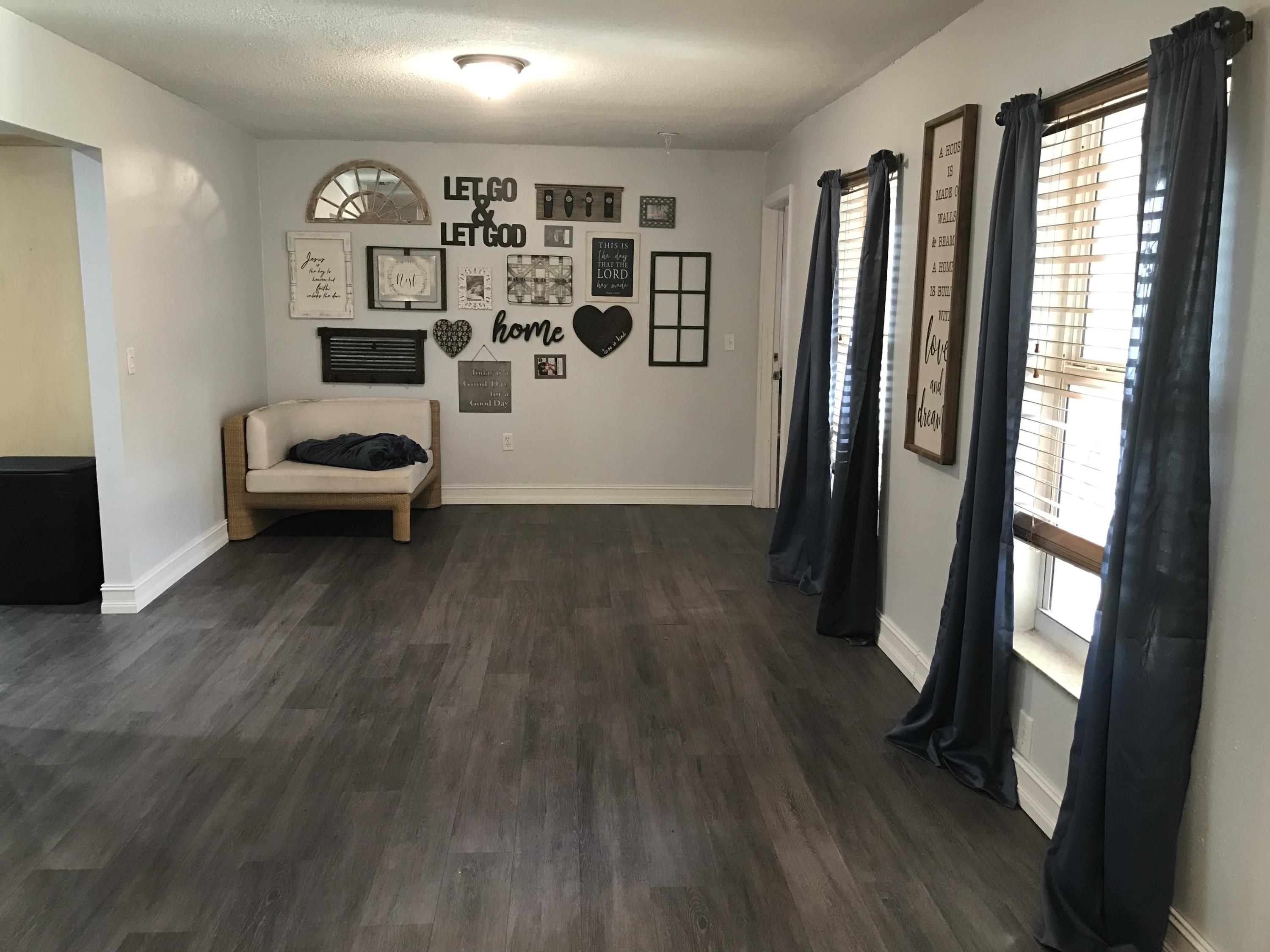 680 Southwest 17th Court Boca Raton, FL 33486 - Photo 8 of 27 a view of a bedroom with wooden floor and windows