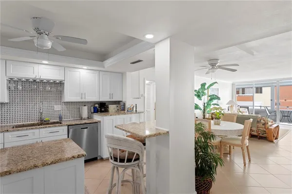 a kitchen with a sink a counter top space and appliances