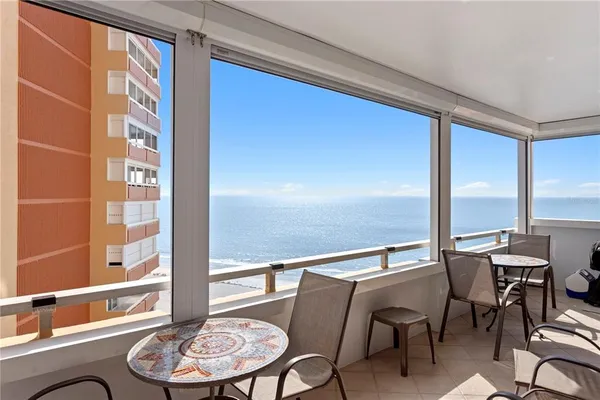 a view of a dining room with furniture window and outside view