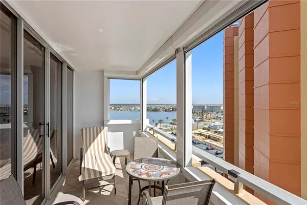 a view of a balcony with chairs