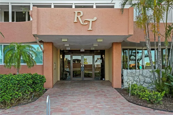 a view of a building with potted plants