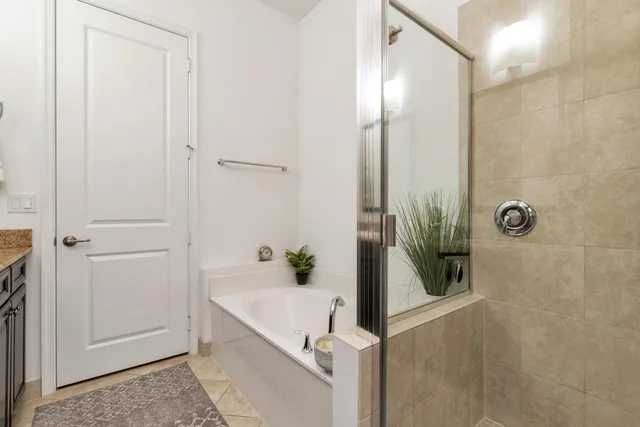 a bathroom with double vanity sinks and a mirror