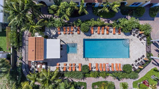 a view of a swimming pool with a lounge chairs
