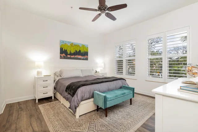 a view of a a dining room with furniture window and wooden floor