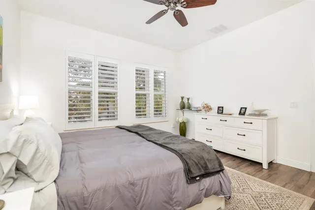 a spacious bedroom with a bed and a window