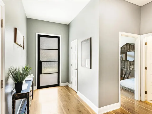 a view of livingroom with hardwood floor and hallway
