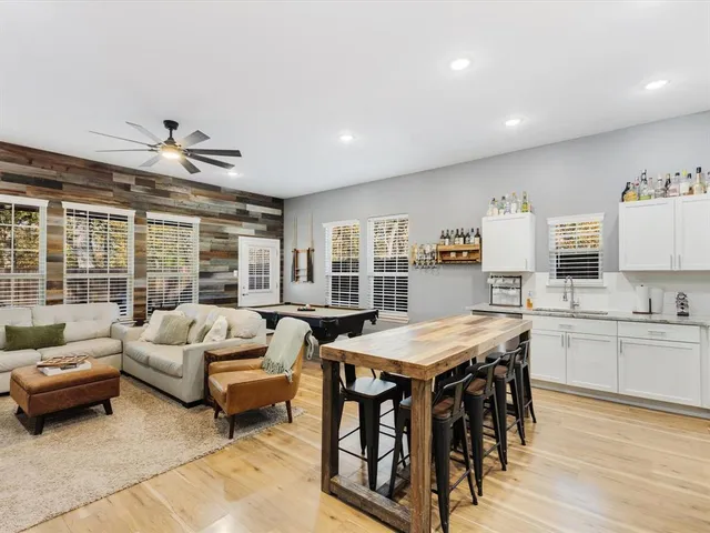 a living room with furniture and a table