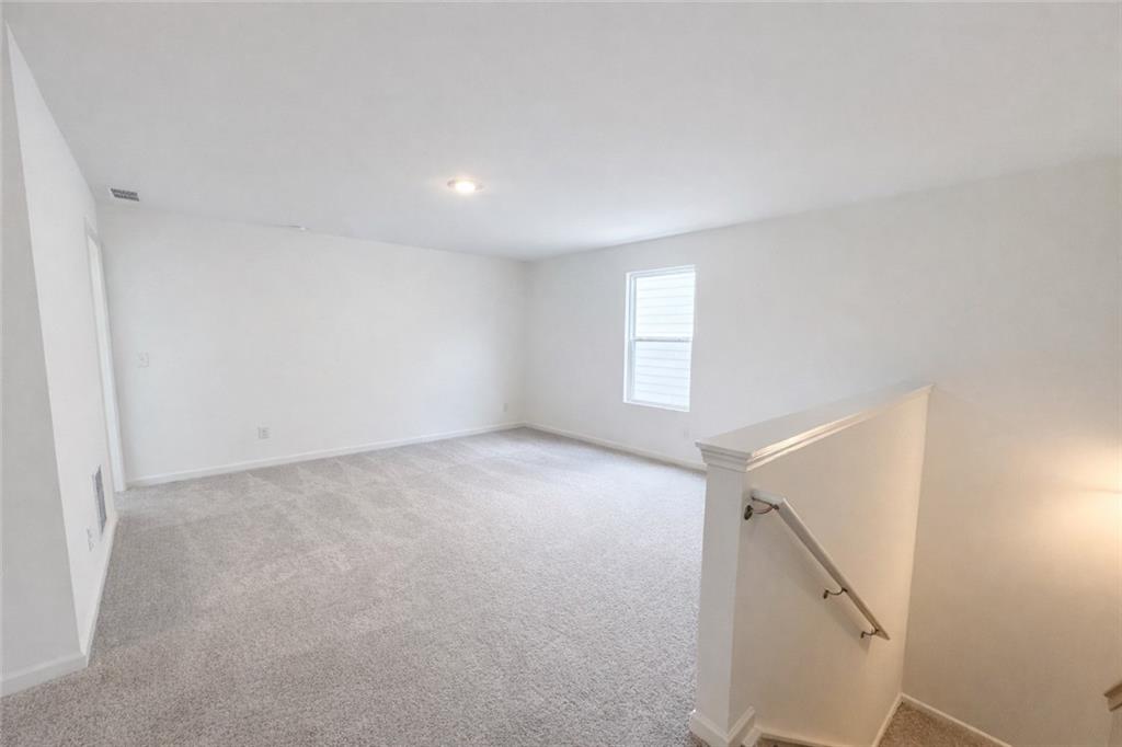 44 Rowlett Place Winder, GA 30680 - Photo 14 of 47 a view of an empty room with a window