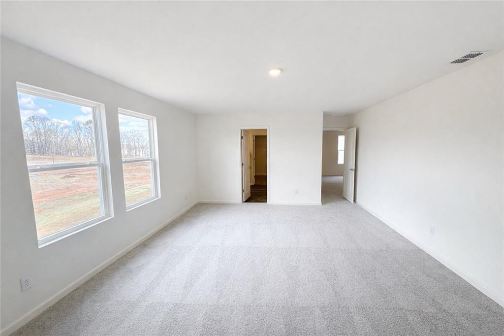 44 Rowlett Place Winder, GA 30680 - Photo 16 of 47 a view of an empty room with a window