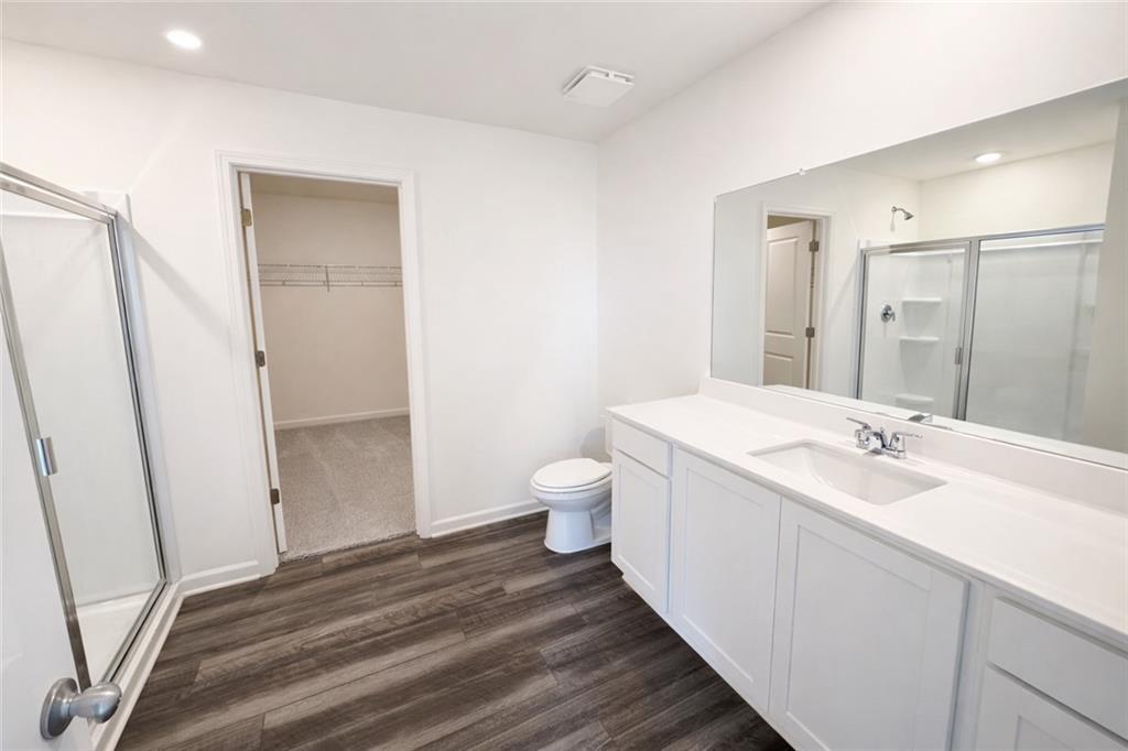 44 Rowlett Place Winder, GA 30680 - Photo 19 of 47 a bathroom with a sink a toilet and shower