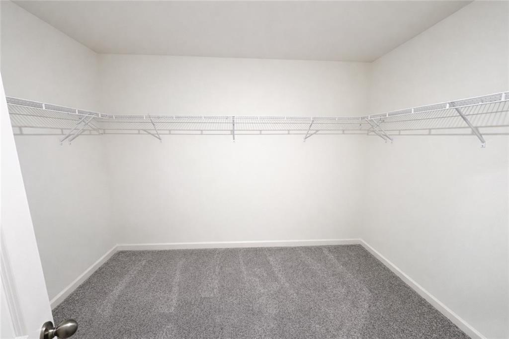 44 Rowlett Place Winder, GA 30680 - Photo 22 of 47 a view of a room with racks on the wall