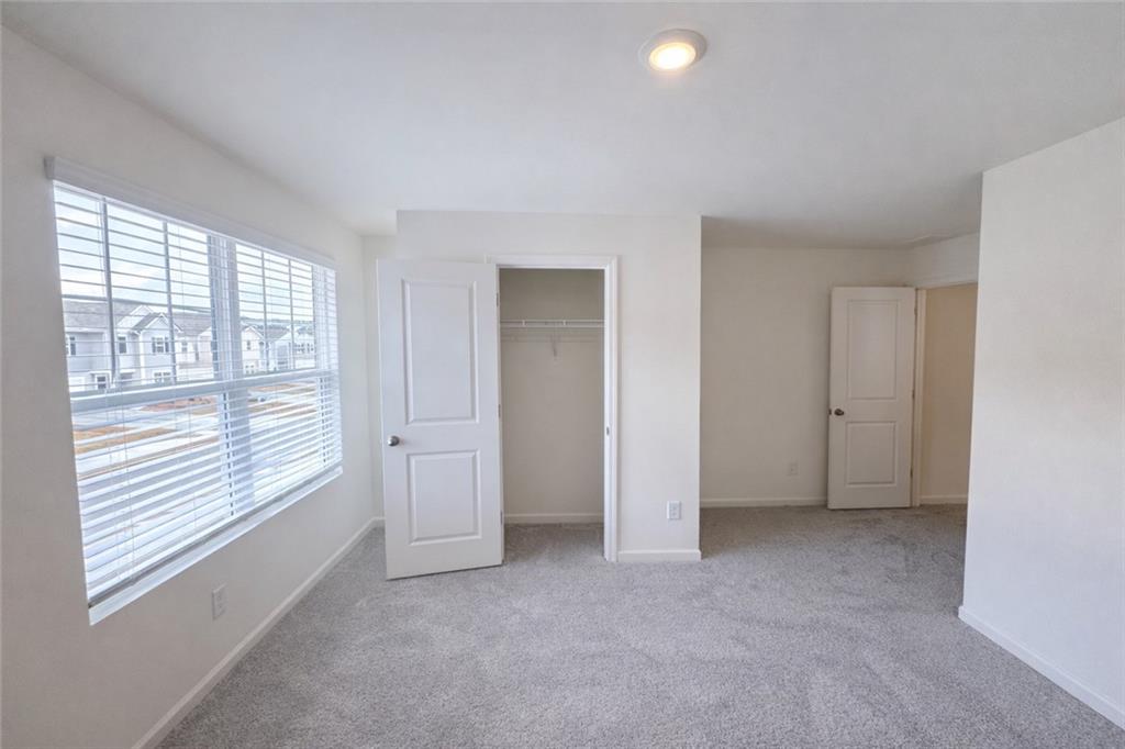 44 Rowlett Place Winder, GA 30680 - Photo 24 of 47 a view of an empty room with a window