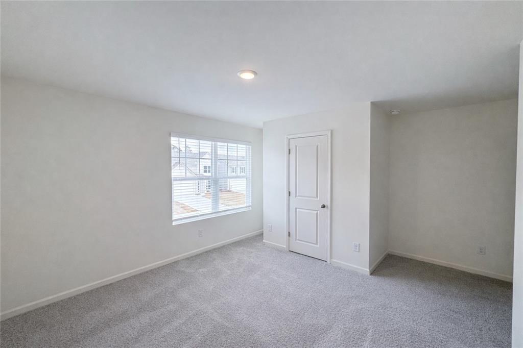 44 Rowlett Place Winder, GA 30680 - Photo 25 of 47 an empty room with windows