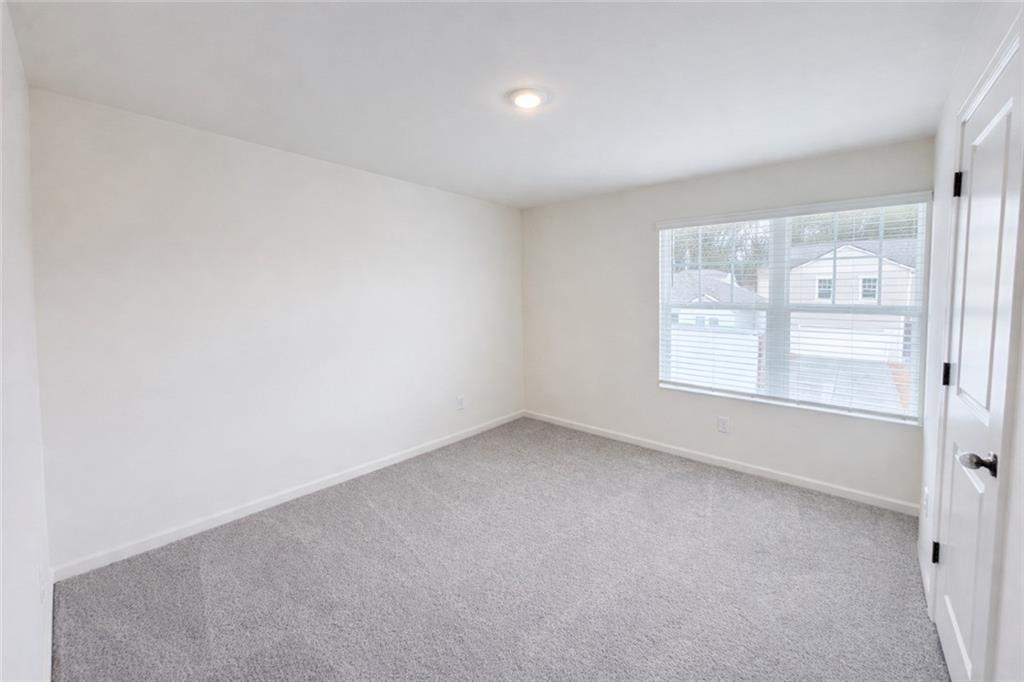 44 Rowlett Place Winder, GA 30680 - Photo 26 of 47 an empty room with windows