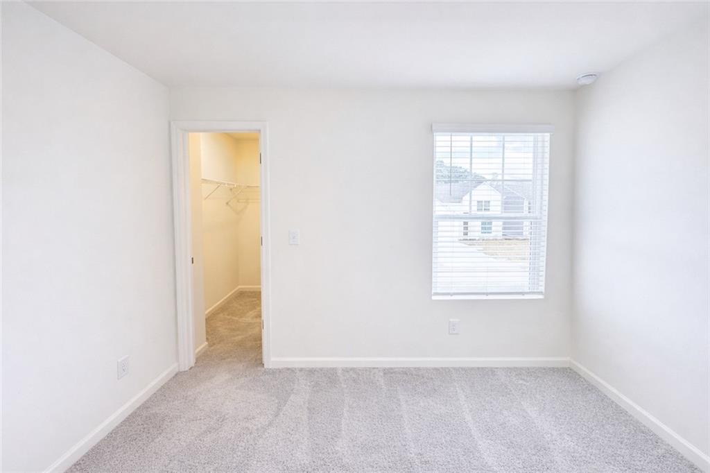 44 Rowlett Place Winder, GA 30680 - Photo 28 of 47 an empty room with windows