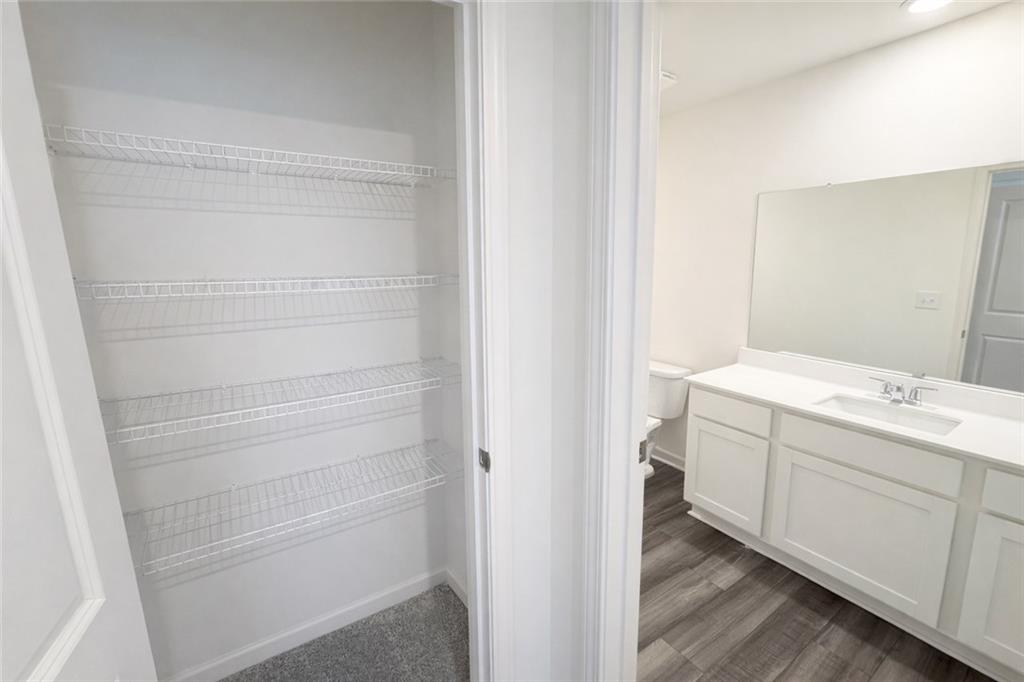 44 Rowlett Place Winder, GA 30680 - Photo 32 of 47 a bathroom with a sink and mirror