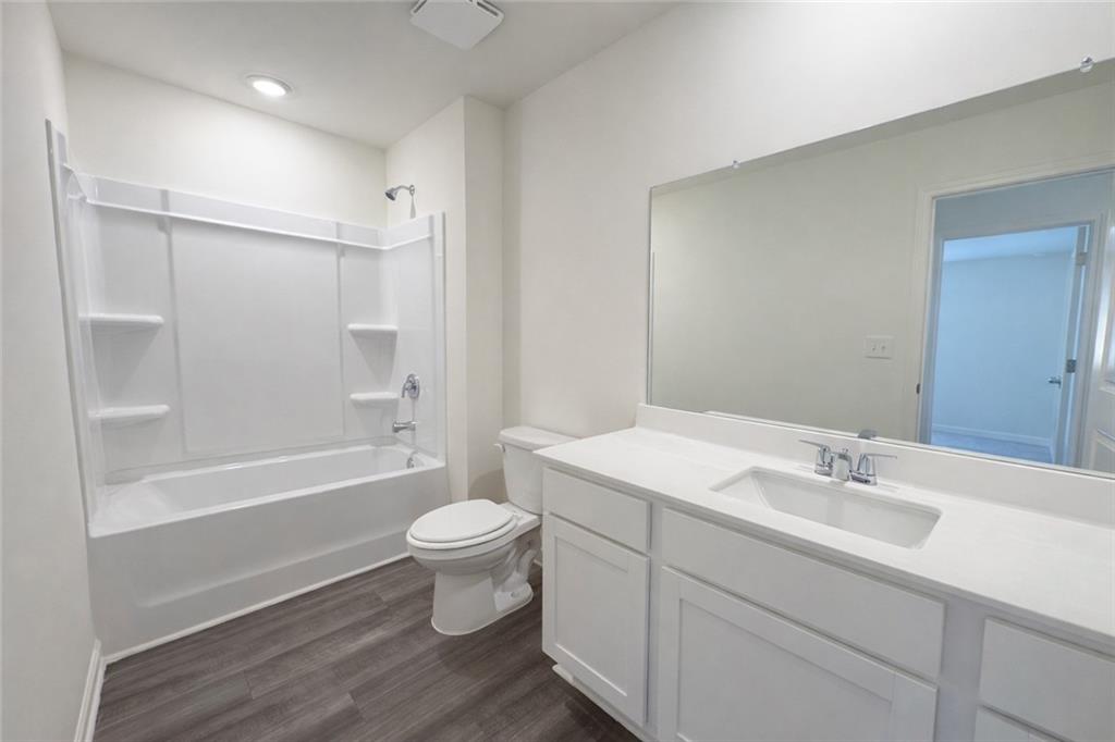 44 Rowlett Place Winder, GA 30680 - Photo 33 of 47 a bathroom with a sink a toilet and shower