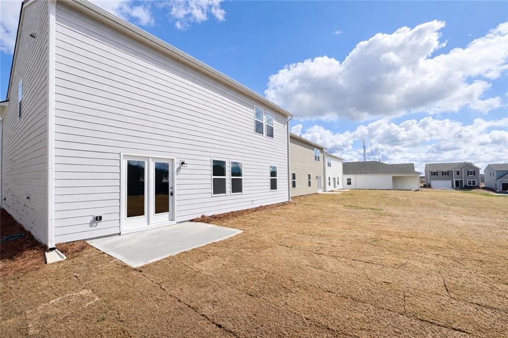 44 Rowlett Place Winder, GA 30680 - Photo 36 of 47 a front view of a house with a yard and garage