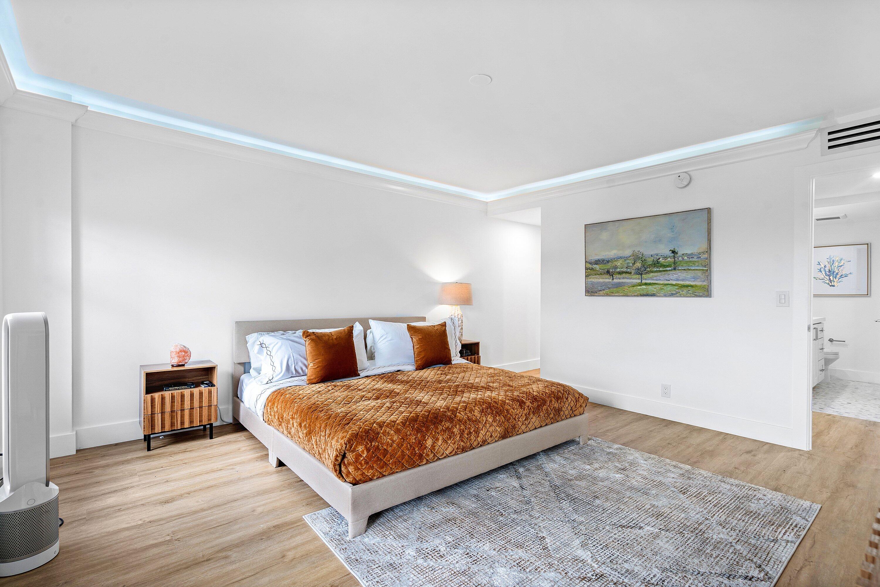 1111 South Ocean Boulevard, Unit 4210 Boca Raton, FL 33432 - Photo 11 of 28 a bedroom with a bed and a night stand