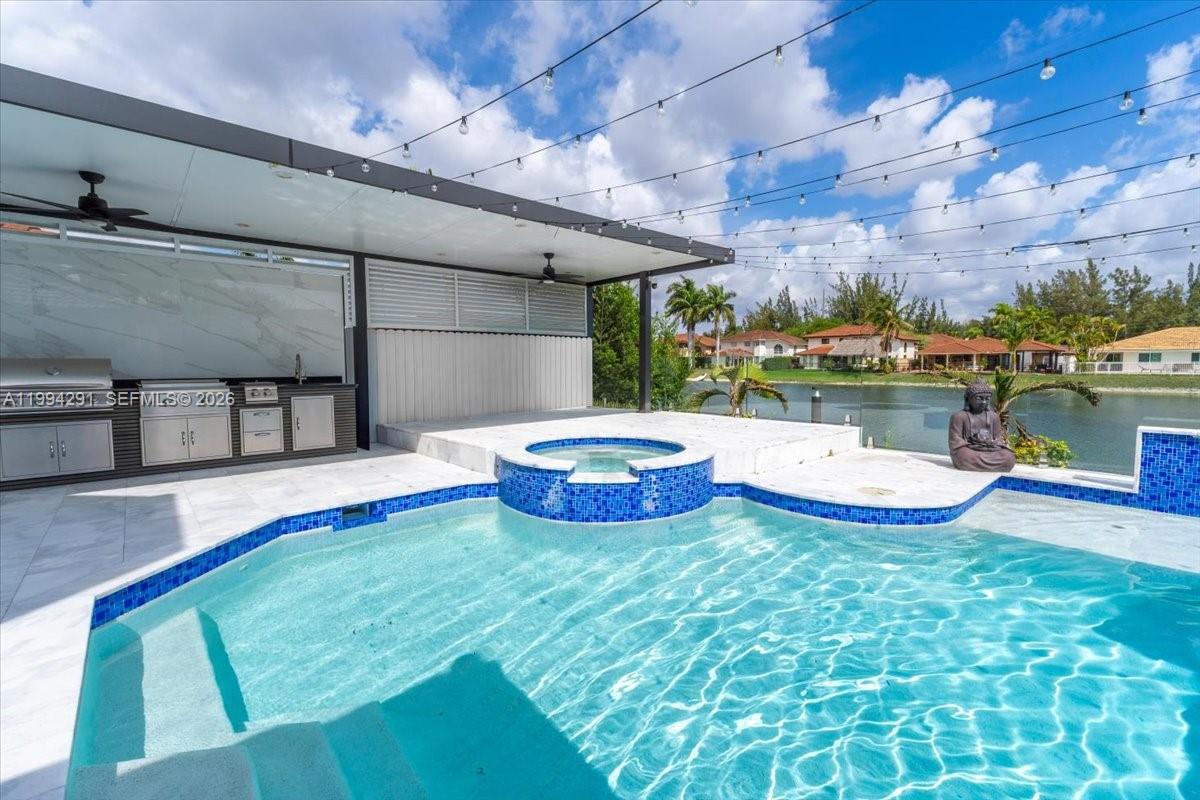 a view of a swimming pool with a table and chairs